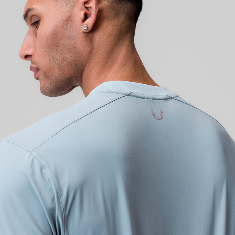 1087. Tetra-Lite® Ice Zip Tee - Light Sky